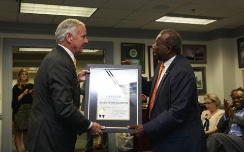 Dr. Louis Lynn is presented the Palmetto of Order, the highest civilian honor in the state.